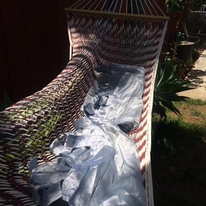 2 long sheer silver Curtain Panels is being swapped online for free