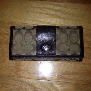 Authentic C Coach large brown wallet  is being swapped online for free