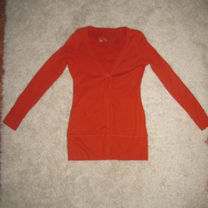 Victorias Secret orange-ish cardigan type shirt is being swapped online for free