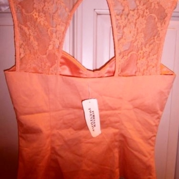 Elegant Peach/orange Corset top S is being swapped online for free