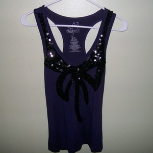 MILEY CYRUS MAX AZRIA PURPLE TOP is being swapped online for free
