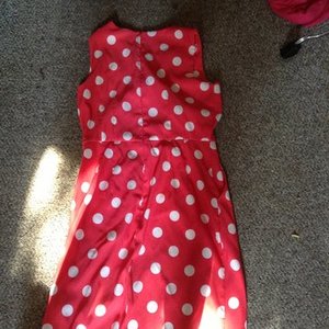 Orange and white polka dot dress is being swapped online for free