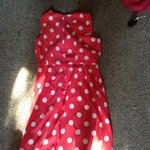 Orange and white polka dot dress is being swapped online for free