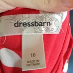 Orange and white polka dot dress is being swapped online for free