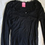 Black top with lace neck is being swapped online for free