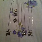 Silver cat necklaces w/ red eyes is being swapped online for free