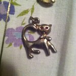 Silver cat necklaces w/ red eyes is being swapped online for free