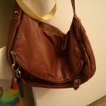 Brown leather tilly's satchel purse is being swapped online for free