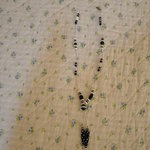 Black and white handmade necklace is being swapped online for free