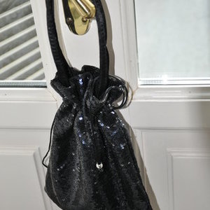 Sequined black satchel is being swapped online for free