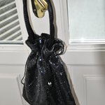 Sequined black satchel is being swapped online for free