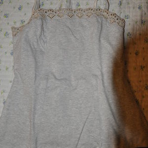 Striped top grey&white is being swapped online for free