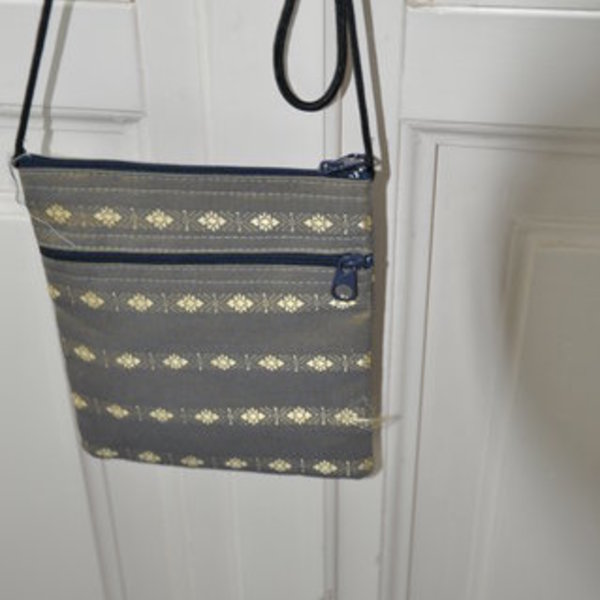 Ethnic shoulder bag in silver gray is being swapped online for free