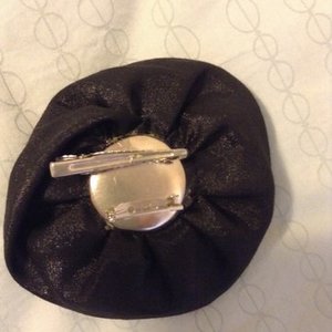 Black flower pin or hair clip is being swapped online for free