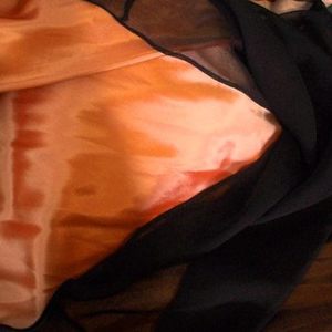 black && orange dress is being swapped online for free