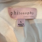 Philosophy Crochet Ruffled Tank is being swapped online for free