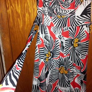 LUNA TIKS VERY FLATTERING PRINTED DRESS is being swapped online for free