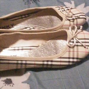 Brand new plaid style beige flats never worn size 5.5 is being swapped online for free