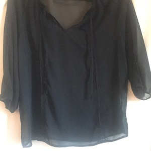 Black sheer blouse  is being swapped online for free