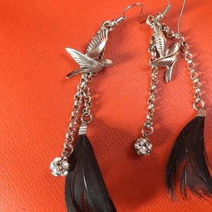 Boho feather jewelry!!One Pair Is Sterling!!! is being swapped online for free