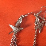 Boho feather jewelry!!One Pair Is Sterling!!! is being swapped online for free