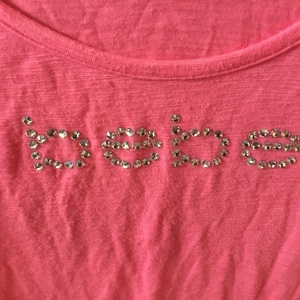 Bebe pink Rhinestone top. Size M is being swapped online for free