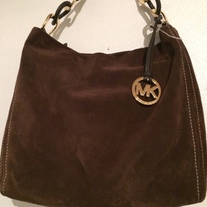 Micheal Kors brown suede purse  is being swapped online for free
