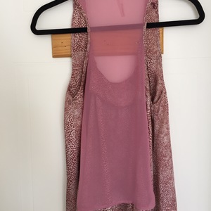 Pink Silky Tank Top with Mesh Strip Back  is being swapped online for free