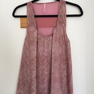 Pink Silky Tank Top with Mesh Strip Back  is being swapped online for free