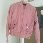Blush pink jacket  is being swapped online for free
