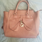 Blush pink purse with bow  is being swapped online for free