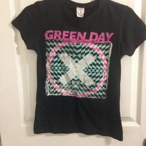 Green Day shirt. Says Medium but fits like Small. Fits tight. Is worn, kinda fading.  is being swapped online for free