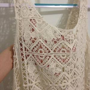 Cream crochet/lace top with fringe. (Fits a bit bigger than a small) is being swapped online for free