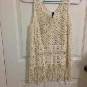 Cream crochet/lace top with fringe. (Fits a bit bigger than a small) is being swapped online for free