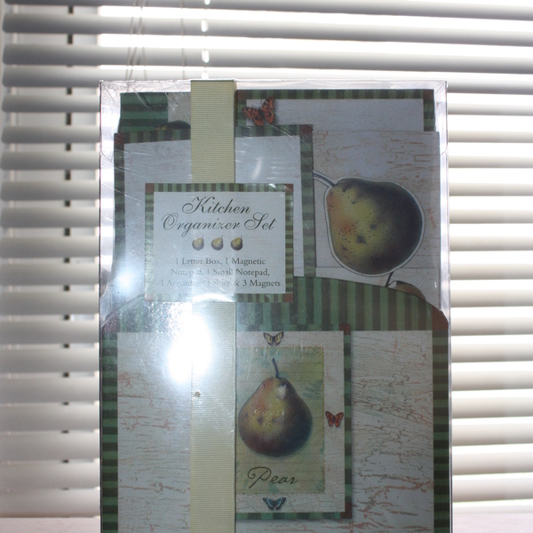 Kitchen organizer set comes with notebook, recipe cards, recipe card holder, magnets, and napkins.  is being swapped online for free