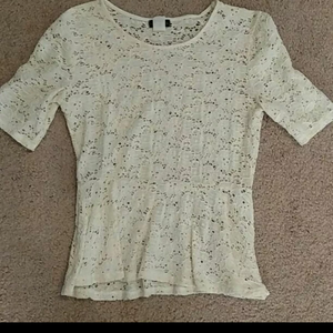 Ivory Lacy Peplum 3/4 Sleeve Top is being swapped online for free