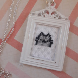 Cross stitch baby Pusheen necklace is being swapped online for free