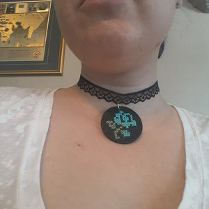 Handmade cross stitched wooden rose choker is being swapped online for free