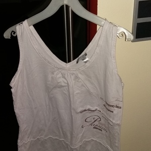 White sleeveles top is being swapped online for free