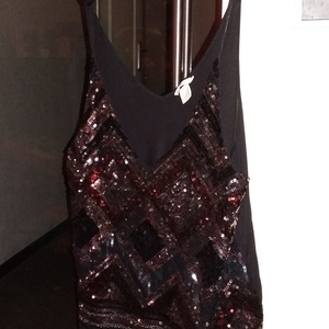 H&M Glitter top. Very deep cut. Sleeveles black L is being swapped online for free