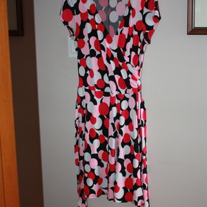 Pink, black, and white poke-a-dot dress is being swapped online for free