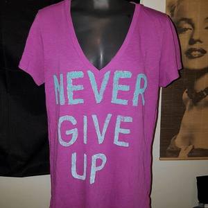 Super Cute '' Never Give Up '' t-shirt :) is being swapped online for free