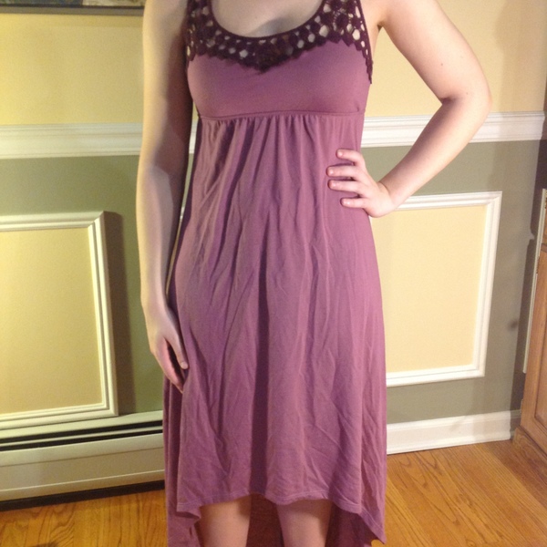 Purple high low dress with lace detail and criss-cross back is being swapped online for free