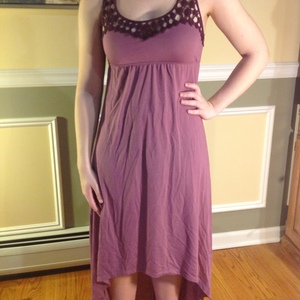Purple high low dress with lace detail and criss-cross back is being swapped online for free