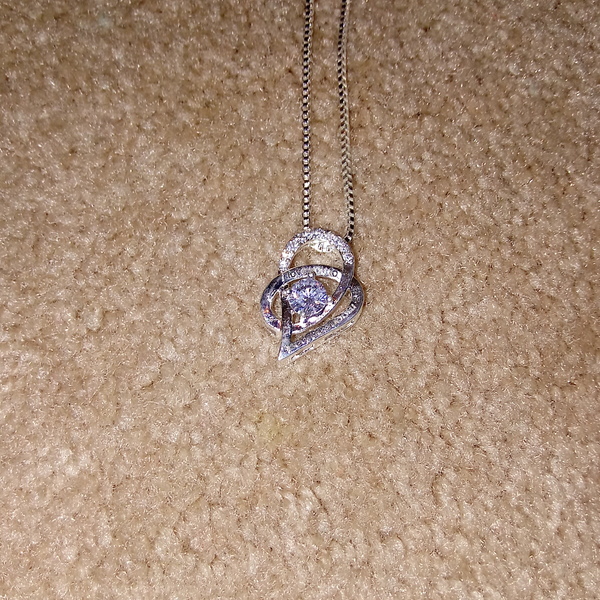 Silver double hearted necklace with 1 diamond. Saying that I love you to the Moon and Stars! is being swapped online for free