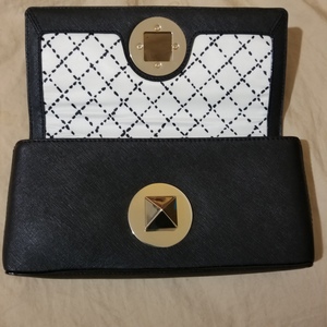NEW Kate Spade Leather Clutch  is being swapped online for free