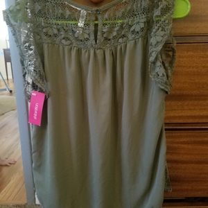 Green lacy new with tags shirt. Size medium. Xhilaration brand is being swapped online for free