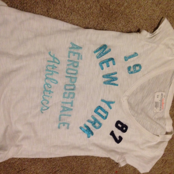 Aéropostale/aero White tee with blue letters is being swapped online for free