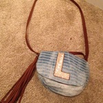 Glitter justice L purse with gold sparkle and free tassel keychain  is being swapped online for free