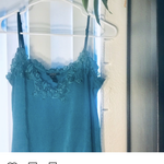 Teal cropped tank top with floral detailed neckline is being swapped online for free